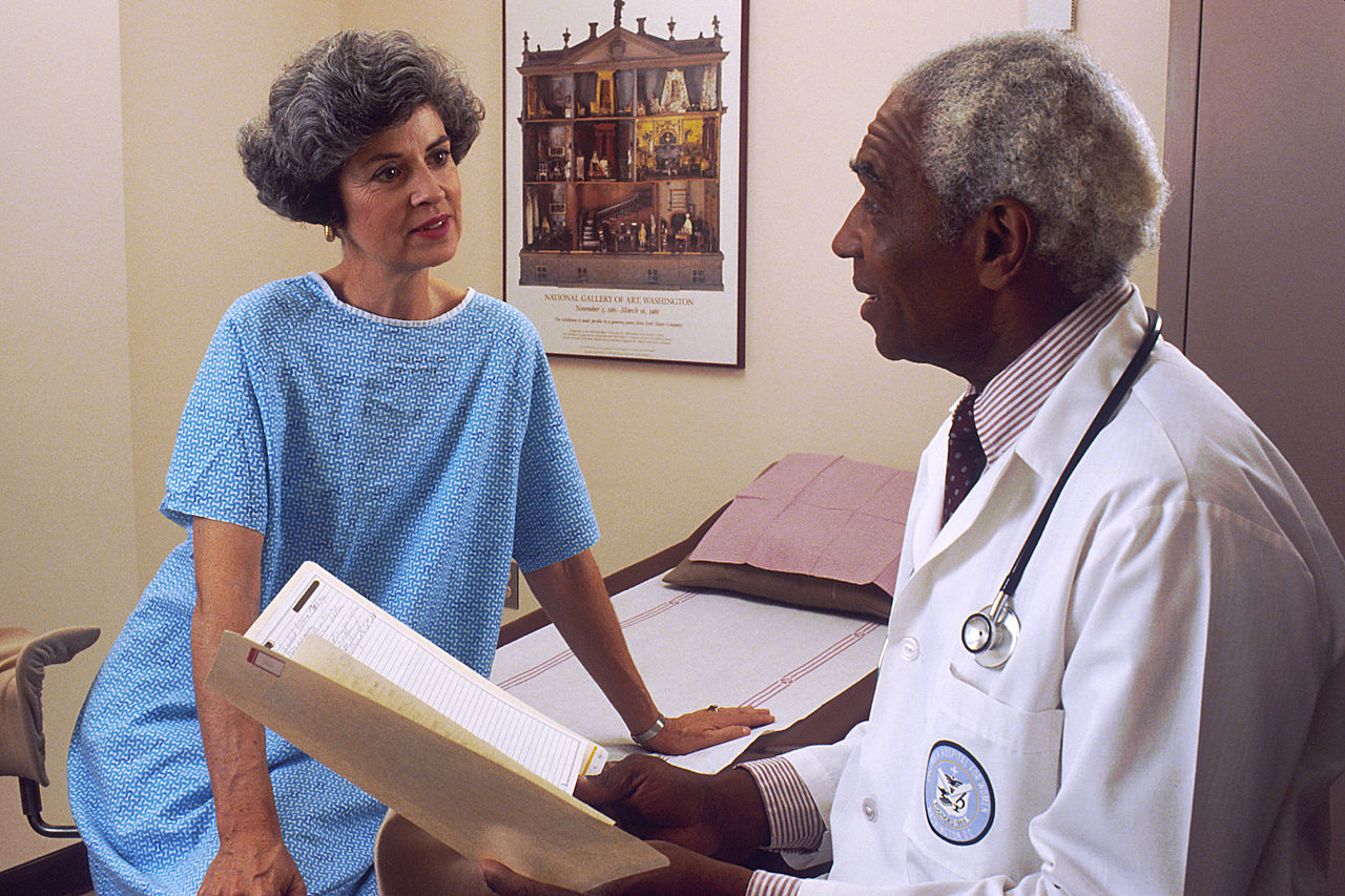 Doctor reviewing notes with a patient—human-in-the-loop